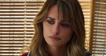 Movie still from “Parallel Mothers” (2021), directed by Pedro Almodóvar – A person with long brown hair; Close Up shot, Over the shoulder angle