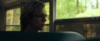 Movie still from “My Friend Dahmer” (2017), directed by Marc Meyers – A man sitting in front of a window on a bus; Close Up shot, Over the shoulder angle