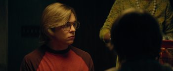 Movie still from “My Friend Dahmer” (2017), directed by Marc Meyers – A man with glasses is looking into the mirror; Close Up shot, Over the shoulder angle