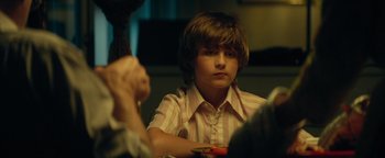 Movie still from “My Friend Dahmer” (2017), directed by Marc Meyers – A boy sitting at a table with a bowl in front of him; Close Up shot, Over the shoulder angle