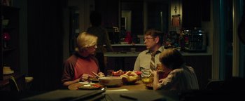 Movie still from “My Friend Dahmer” (2017), directed by Marc Meyers – Three people sitting at a table eating food; Medium shot, Over the shoulder angle