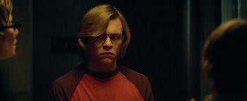 Movie still from “My Friend Dahmer” (2017), directed by Marc Meyers – A young man with glasses is looking at the camera; Close Up shot, Over the shoulder angle