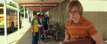 Movie still from “My Friend Dahmer” (2017), directed by Marc Meyers – A group of young men standing next to bicycles; Medium shot, Over the shoulder angle