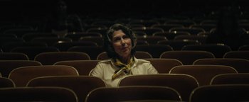 Movie still from “My Friend Dahmer” (2017), directed by Marc Meyers – An older woman sitting in an empty theater; Medium shot, Low angle