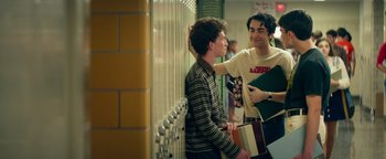 Movie still from “My Friend Dahmer” (2017), directed by Marc Meyers – Two young men standing next to each other in front of a wall; Medium shot, Over the shoulder angle