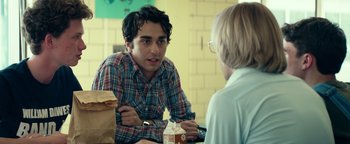 Movie still from “My Friend Dahmer” (2017), directed by Marc Meyers – A man sitting in front of another man at a table; Medium shot, Over the shoulder angle