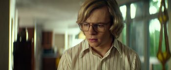 Movie still from “My Friend Dahmer” (2017), directed by Marc Meyers – A man with glasses is looking down at his face; Close Up shot, Over the shoulder angle