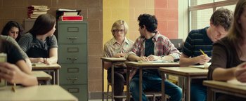 Movie still from “My Friend Dahmer” (2017), directed by Marc Meyers – Two people sitting at a table in front of each other; Medium shot, Over the shoulder angle