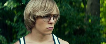 Movie still from “My Friend Dahmer” (2017), directed by Marc Meyers – A person wearing glasses; Close Up shot, Over the shoulder angle