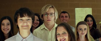 Movie still from “My Friend Dahmer” (2017), directed by Marc Meyers – A group of young people posing for a picture; Close Up shot, Low angle