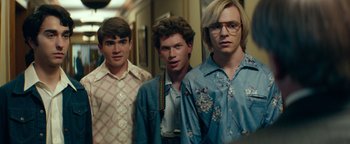 Movie still from “My Friend Dahmer” (2017), directed by Marc Meyers – A group of young men standing next to each other in a hallway; Medium shot, Low angle