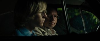 Movie still from “My Friend Dahmer” (2017), directed by Marc Meyers – A man and a woman sitting in a car looking out of the window; Close Up shot, Over the shoulder angle