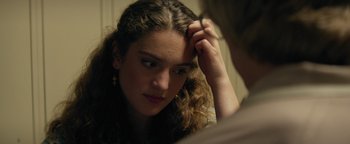 Movie still from “My Friend Dahmer” (2017), directed by Marc Meyers – A woman looking at herself in the mirror; Close Up shot, Over the shoulder angle
