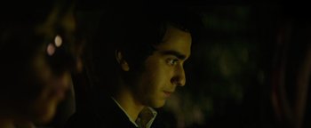 Movie still from “My Friend Dahmer” (2017), directed by Marc Meyers – A young man in a suit and tie looking to his left; Close Up shot, Over the shoulder angle