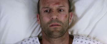 Movie still from “Parker” (2013), directed by Taylor Hackford – A person laying in a bed; Close Up shot, Low angle