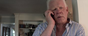 Movie still from “Parker” (2013), directed by Taylor Hackford – An older man talking on a cell phone; Close Up shot, Low angle