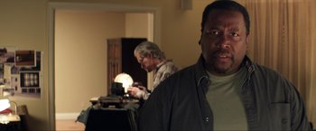 Movie still from “Parker” (2013), directed by Taylor Hackford – Two men standing next to each other in a room; Close Up shot, Over the shoulder angle