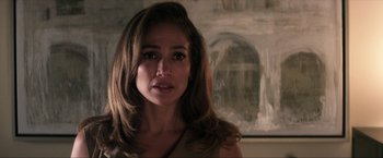 Movie still from “Parker” (2013), directed by Taylor Hackford – A person with long brown hair; Close Up shot, Over the shoulder angle