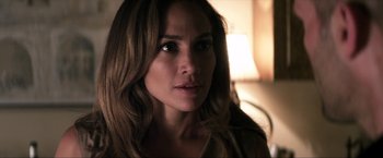 Movie still from “Parker” (2013), directed by Taylor Hackford – A person with long brown hair; Close Up shot, Over the shoulder angle