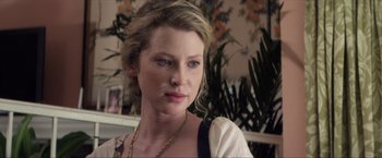 Movie still from “Parker” (2013), directed by Taylor Hackford – A person wearing a necklace; Close Up shot, Over the shoulder angle