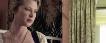 Movie still from “Parker” (2013), directed by Taylor Hackford – A person wearing a white shirt; Close Up shot, Over the shoulder angle