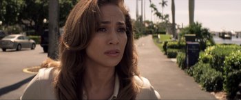 Movie still from “Parker” (2013), directed by Taylor Hackford – A person with long brown hair; Close Up shot, Over the shoulder angle