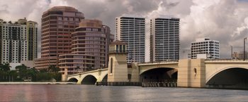 Movie still from “Parker” (2013), directed by Taylor Hackford – A view of a bridge with a tower in the middle of it; Extreme Wide shot, High angle