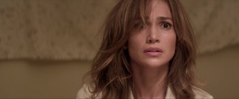 Movie still from “Parker” (2013), directed by Taylor Hackford – A person with long brown hair; Close Up shot, Over the shoulder angle