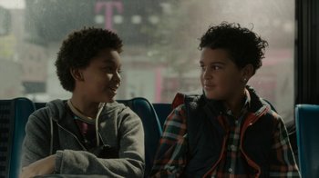 Movie still from “Paterson” (2016), directed by Jim Jarmusch – Two young boys sitting next to each other on a bus; Close Up shot, Over the shoulder angle