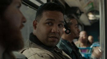 Movie still from “Paterson” (2016), directed by Jim Jarmusch – A group of people sitting on a bus; Close Up shot, Over the shoulder angle