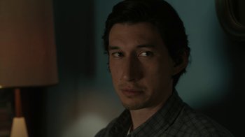 Movie still from “Paterson” (2016), directed by Jim Jarmusch – A person wearing a plaid shirt; Close Up shot, Over the shoulder angle