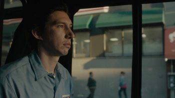 Movie still from “Paterson” (2016), directed by Jim Jarmusch – A man standing in front of a store window; Close Up shot, Low angle