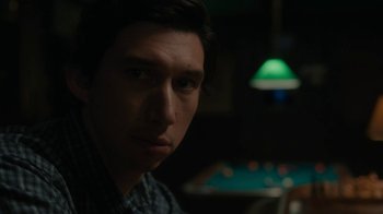 Movie still from “Paterson” (2016), directed by Jim Jarmusch – A young man is sitting at a pool table; Close Up shot, Over the shoulder angle