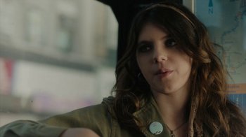 Movie still from “Paterson” (2016), directed by Jim Jarmusch – A person with long brown hair; Close Up shot, Over the shoulder angle