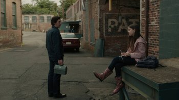 Movie still from “Paterson” (2016), directed by Jim Jarmusch – A man and a woman sitting on a bench in the street; Wide shot, Over the shoulder angle