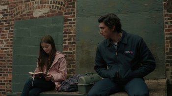Movie still from “Paterson” (2016), directed by Jim Jarmusch – A man and a woman sitting on a bench; Medium shot, Over the shoulder angle