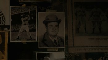 Movie still from “Paterson” (2016), directed by Jim Jarmusch – An old photo of a man wearing a hat; Extreme Close Up shot, High angle
