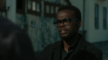 Movie still from “Paterson” (2016), directed by Jim Jarmusch – A man wearing glasses and a black jacket; Close Up shot, Over the shoulder angle