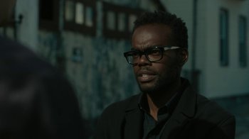 Movie still from “Paterson” (2016), directed by Jim Jarmusch – A man in a black jacket and glasses looking to his left; Close Up shot, Low angle