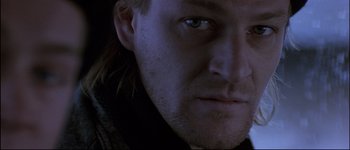 Movie still from “Patriot Games” (1992), directed by Phillip Noyce – A man's face in the dark; Close Up shot, Low angle