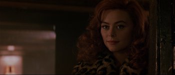 Movie still from “Patriot Games” (1992), directed by Phillip Noyce – A person wearing a leopard print coat; Close Up shot, Over the shoulder angle