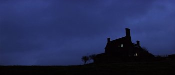 Movie still from “Patriot Games” (1992), directed by Phillip Noyce – A house with a tree in front of it at night time; Extreme Wide shot, Low angle