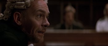 Movie still from “Patriot Games” (1992), directed by Phillip Noyce – A person with a beard; Close Up shot, Low angle