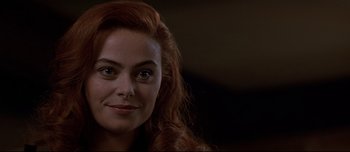 Movie still from “Patriot Games” (1992), directed by Phillip Noyce – A person with long red hair; Close Up shot, Over the shoulder angle
