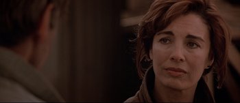 Movie still from “Patriot Games” (1992), directed by Phillip Noyce – A woman's face in a brown jacket; Close Up shot, Over the shoulder angle