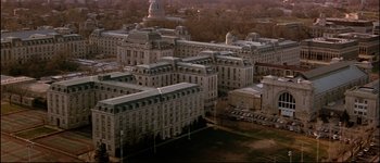 Movie still from “Patriot Games” (1992), directed by Phillip Noyce – An aerial view of a large city with many large buildings; Extreme Wide shot, High angle
