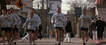 Movie still from “Patriot Games” (1992), directed by Phillip Noyce – A group of people running in a street; Wide shot, Low angle