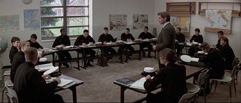 Movie still from “Patriot Games” (1992), directed by Phillip Noyce – A group of people sitting at tables in a room; Wide shot, High angle