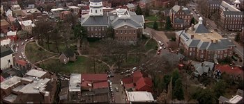 Movie still from “Patriot Games” (1992), directed by Phillip Noyce – An aerial view of an old building in a city; Extreme Wide shot, High angle