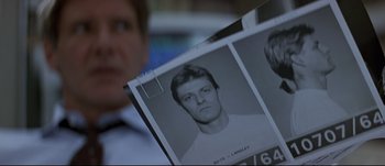 Movie still from “Patriot Games” (1992), directed by Phillip Noyce – A black and white photo of a man's face; Close Up shot, Low angle